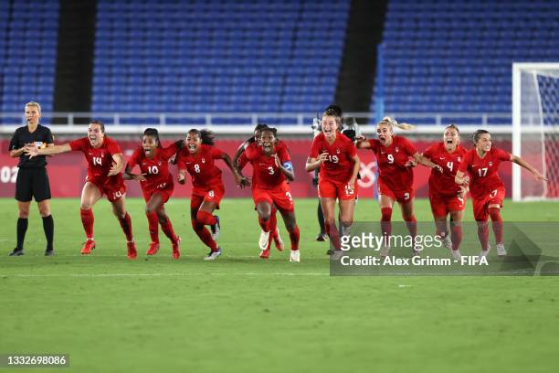 Kadeisha Buchanan of Team Canada and teammates run to celebrate after Julia Grosso scored the winning penalty in the shootout during the Women's Gold...