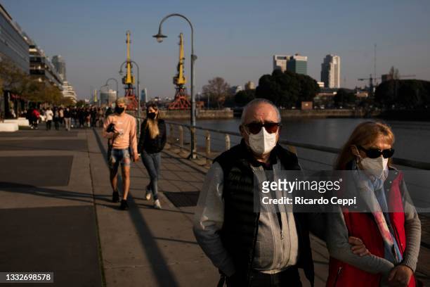 Tourists walks in the waterfront of Puerto Madero on August 01, 2021 in Buenos Aires, Argentina. Due the progress in the vaccination campaign against...