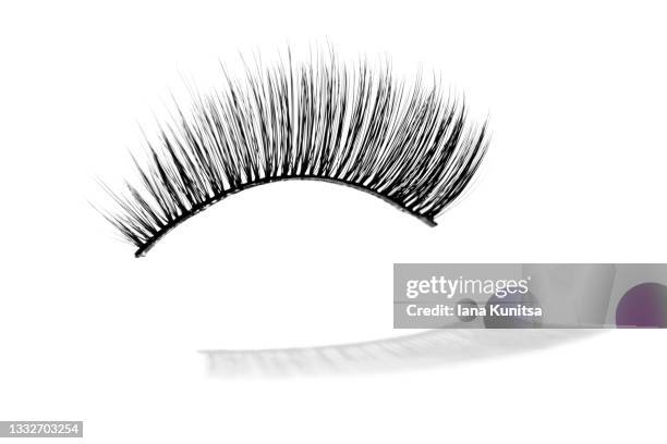 false eyelash and their shadow on white background, isolated. mascara. beauty pattern. makeup accessories concept. cosmetics products. eyelash extension tools. closeup. - wimpern stock-fotos und bilder