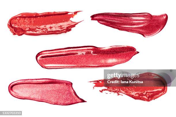 set of red lipstick smears on white background. isolated for design. lip gloss samples are smudged. beauty cosmetic. makeup and skin care products. closeup. - blusher fotografías e imágenes de stock