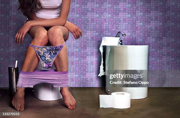 woman in the toilet - tanga stock-fotos und bilder