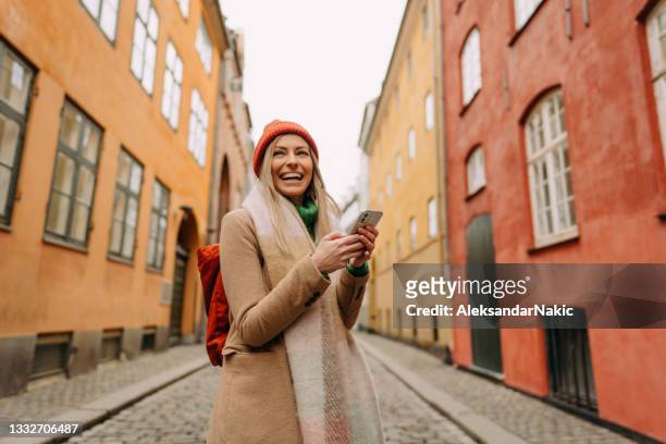 using mobile phone while traveling - winter denmark stock pictures, royalty-free photos & images