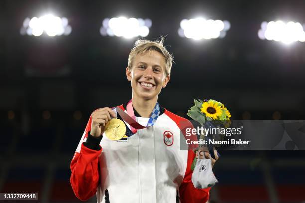 Gold medalist Quinn of Team Canada poses with their gold medal during the Women's Football Competition Medal Ceremony on day fourteen of the Tokyo...
