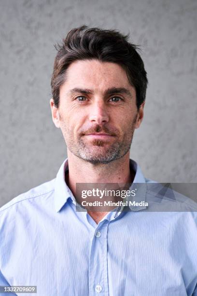 portrait of smiling handsome mid adult man - husband stock pictures, royalty-free photos & images