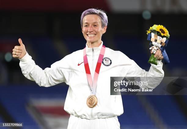 Bronze medalist Megan Rapinoe of Team United States poses with their bronze medal during the Women's Football Competition Medal Ceremony on day...