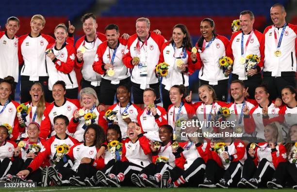 Gold Medalists of Team Canada pose with their gold medals during the Women's Football Competition Medal Ceremony on day fourteen of the Tokyo 2020...