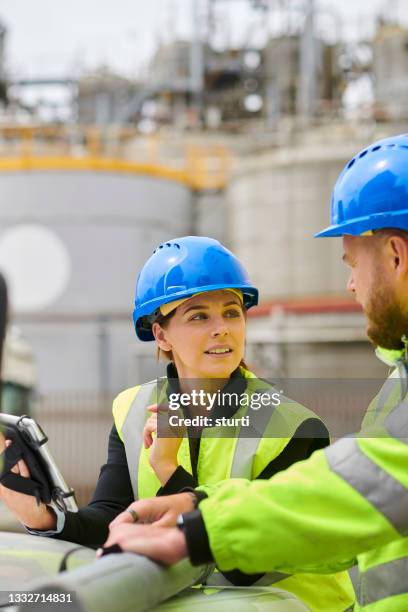 female engineer at chemical plant - chemical plant stock pictures, royalty-free photos & images