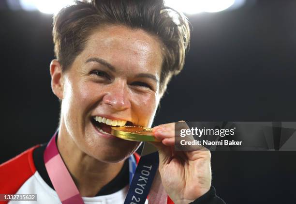 Gold medalist Erin McLeod of Team Canada poses with their gold medal during the Women's Football Competition Medal Ceremony on day fourteen of the...