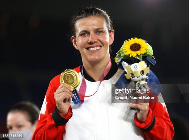 Gold medalist Christine Sinclair of Team Canada poses with their gold medal during the Women's Football Competition Medal Ceremony on day fourteen of...