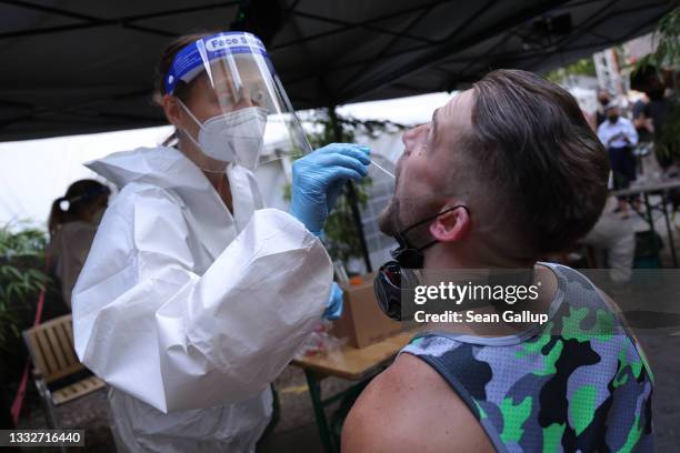 Participant submits for an express PCR test for Covid-19 outside the KiKat Club prior to taking part in an experimental, limited opening of Berlin...