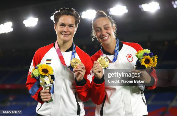 Gold medalists Evelyne Viens and Kailen Sheridan of Team Canada pose with their medals during the Women's Football Competition Medal Ceremony on day...