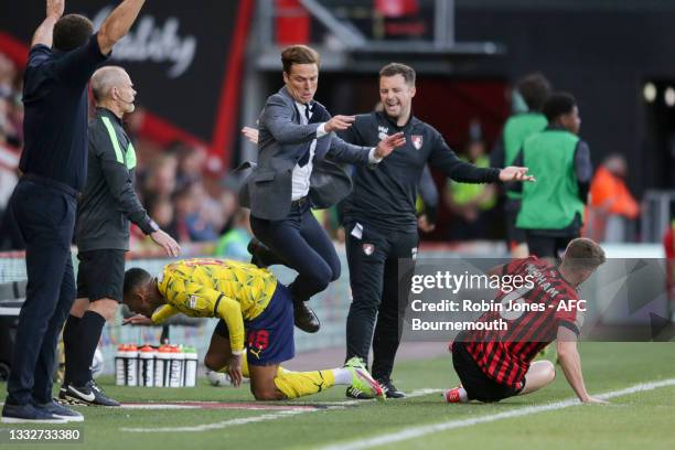 Karlan Grant of West Bromwich Albion clatters into Head Coach Scott Parker of Bournemouth sending him to the ground during the Sky Bet Championship...