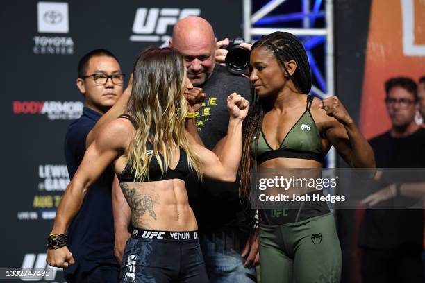 Tecia Torres and Angela Hill face off during the UFC 265 ceremonial weigh-in at Toyota Center on August 06, 2021 in Houston, Texas.
