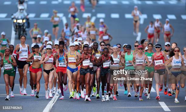 Athletes compete in the Women's Marathon Final on day fifteen of the Tokyo 2020 Olympic Games at Sapporo Odori Park on August 07, 2021 in Sapporo,...