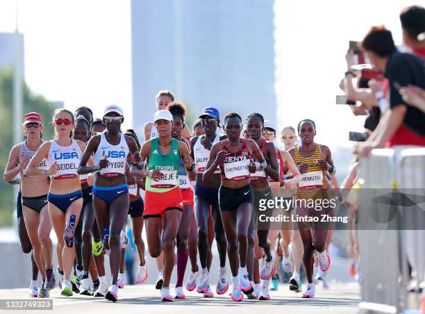 Molly Seidel of Team United States, Sally Kipyego of Team United States, Roza Dereje of Team Ethiopia, Lonah Chemtai Salpeter of Team Israel and Ruth...