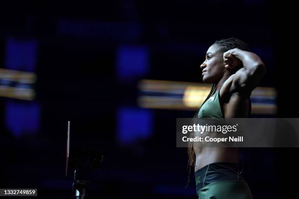 Angela Hill poses on the scale during the UFC 265 ceremonial weigh-in at Toyota Center on August 06, 2021 in Houston, Texas.