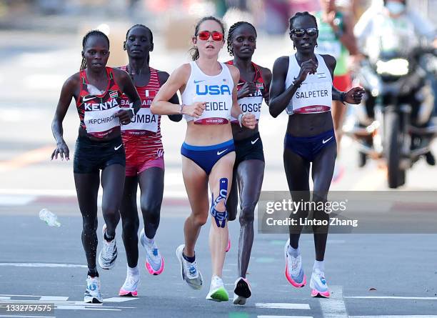 Peres Jepchirchir of Team Kenya, Eunice Chebichii Chumba of Team Bahrain, Molly Seidel of Team United States Brigid Kosgei of Team Kenya and Lonah...