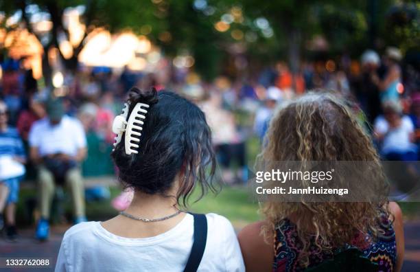 santa fe, nm: two women's hairstyles (rear view) on plaza - hair clip stock pictures, royalty-free photos & images