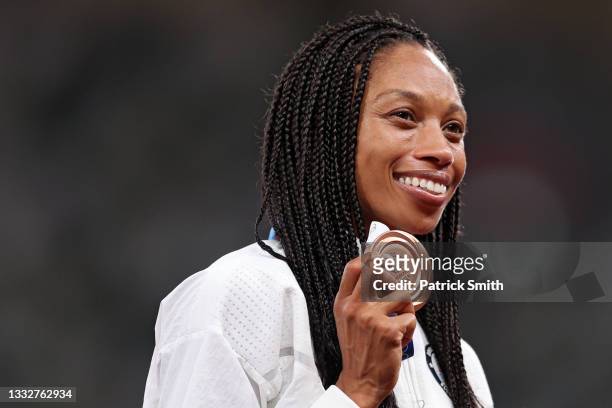 Bronze medalist Allyson Felix of Team USA receives her medal on the podium during the medal ceremony for the Women's 400m on day fourteen of the...