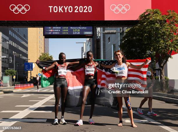 Gold medalist Peres Jepchirchir of Team Kenya, silver medalist Brigid Kosgei of Team Kenya and bronze medalist Molly Seidel of Team United States...