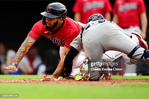 Bobby Bradley of the Cleveland Indians is tagged out by Eric Haase of the Detroit Tigers at home plate in the third inning during their game at...