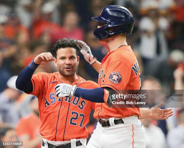 Chas McCormick of the Houston Astros is congratulated by Jose Altuve after hitting a solo home run in the fourth inning against the Minnesota Twins...