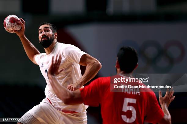 Nikola Karabatic of Team France shoots at goal as Yahia Omar of Team Egypt defends during the Men's Semifinal handball match between France and Egypt...