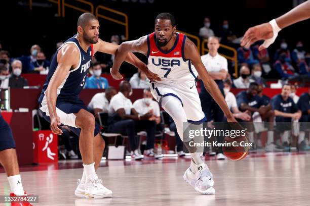 Kevin Durant of Team United States\ drives to the basket against Nicolas Batum of Team France during the first half of a Men's Basketball Finals game...