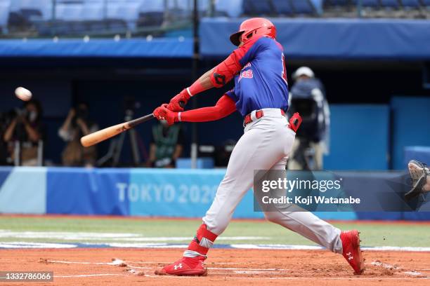 Outfielder Julio Rodriguez of Team Dominican Republic hits a two-run home run in the first inning against Team Republic of Korea in the during the...