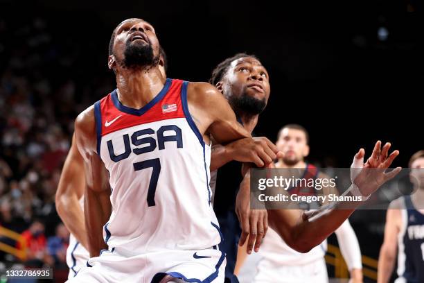 Kevin Durant of Team United States boxes out Guerschon Yabusele of Team France during the first half of a Men's Basketball Finals game on day fifteen...