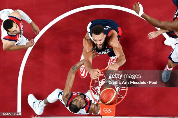 Rudy Gobert of Team France dunks against Kevin Durant of Team United States during the first half of a Men's Basketball Finals game on day fifteen of...