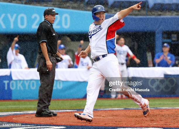 Outfielder Hyunsoo Kim of Team Republic of Korea celebrates scoring a run by a RBI single of Outfielder Kunwoo Park during the bronze medal game...