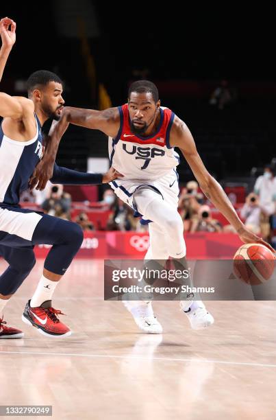 Kevin Durant of Team United States drives to the basket against Timothe Luwawu Kongbo of Team France during the second half of a Men's Basketball...
