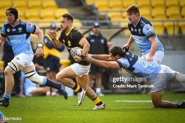 Wes Goosen of the Wellington Lions evades Blake Hohaia of Northland Taniwha during the round one Bunnings NPC match between Wellington and Northland...