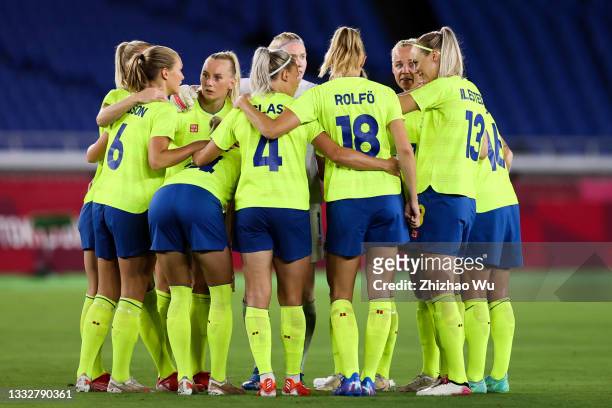 Players of Team Sweden encourage each other during the Olympic women's football gold medal match between Sweden and Canada at International Stadium...