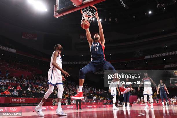 Rudy Gobert of Team France dunks against Kevin Durant of Team United States during the first half of a Men's Basketball Finals game on day fifteen of...