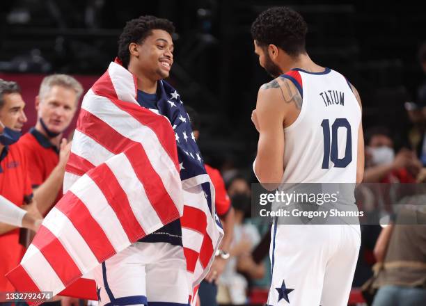 Keldon Johnson of Team United States and teammate Jayson Tatum celebrate their win over France in the Men's Basketball Finals game on day fifteen of...