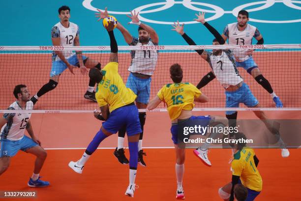 Yoandy Leal Hidalgo of Team Brazil and Sebastian Sole of Team Argentina battle at the net during the Men's Bronze Medal Match on day fifteen of the...