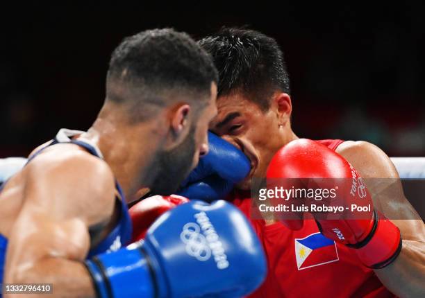 Galal Yafai of Team Great Britain punches Carlo Paalam of Team Philippines during the Men's Fly Final bout between Carlo Paalam of Team Philippines...