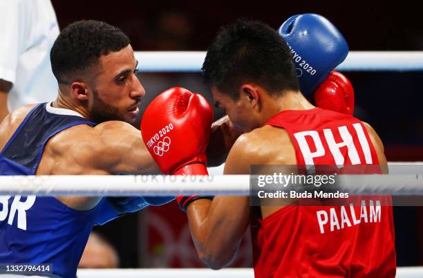 Galal Yafai of Team Great Britain punches Carlo Paalam of Team Philippines during the Men's Fly Final bout between Carlo Paalam of Team Philippines...