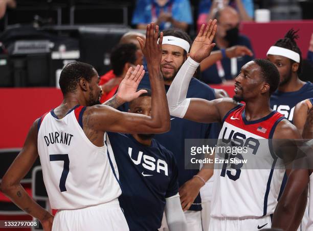 Bam Adebayo of Team United States high-fives teammate Kevin Durant following the United States' victory over France in the Men's Basketball Finals...