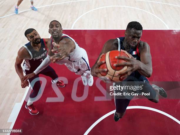 Moustapha Fall of Team France grabs a rebound against Bam Adebayo of Team United States as teammate Timothe Luwawu Kongbo looks on during the second...