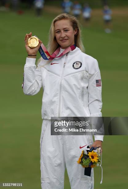 Nelly Korda of Team United States celebrates with the gold medal during the Victory Ceremony after the final round of the Women's Individual Stroke...