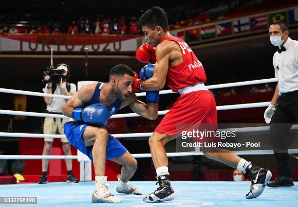 Galal Yafai of Team Great Britain dodges a punch from Carlo Paalam of Team Philippines on day fifteen of the Tokyo 2020 Olympic Games at Kokugikan...