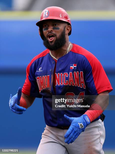 Outfielder Emilio Bonifacio of Team Dominican Republic celebrates a infield single in the sixth inning against Team Republic of Korea during the...