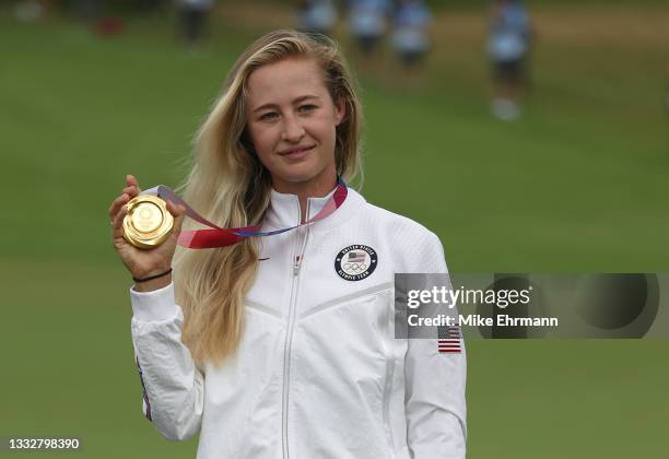 Nelly Korda of Team United States celebrates with the gold medal at the victory ceremony after the final round of the Women's Individual Stroke Play...