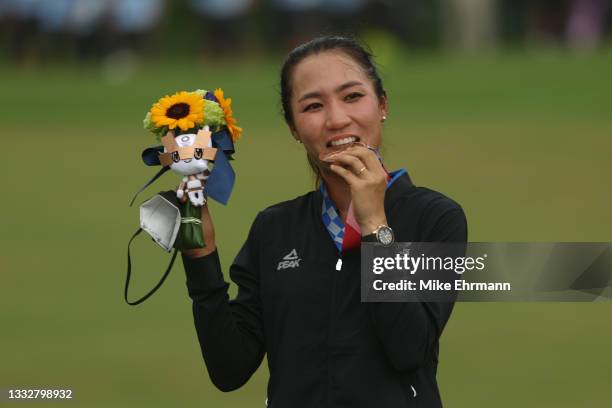 Lydia Ko of Team New Zealand celebrates with the silver medal at the victory ceremony after the final round of the Women's Individual Stroke Play on...
