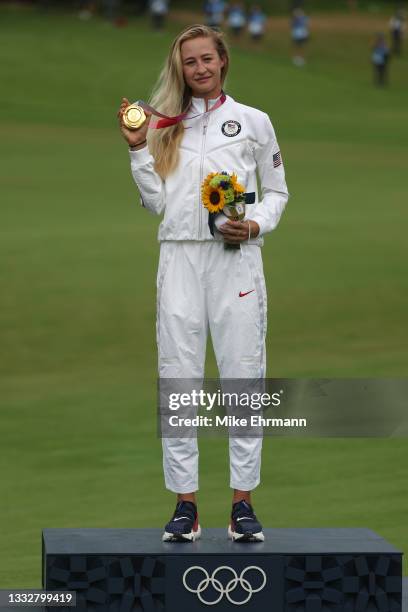 Nelly Korda of Team United States celebrates with the gold medal at the victory ceremony after the final round of the Women's Individual Stroke Play...