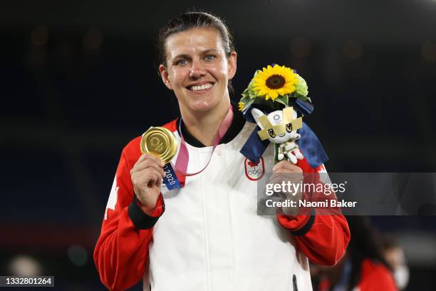 Christine Sinclair of Team Canada poses with her gold medal after her teams victory during the Gold Medal Match Women's Football match between Canada...