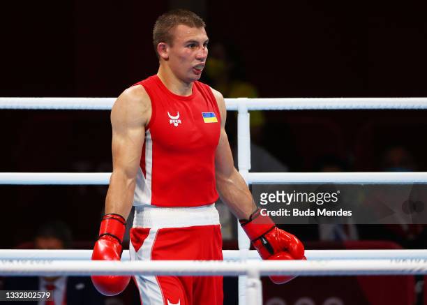 Oleksandr Khyzhniak of Team Ukraine reacts to defeat and winning a silver medal during the Men's Middle Final bout between Oleksandr Khyzhniak of...